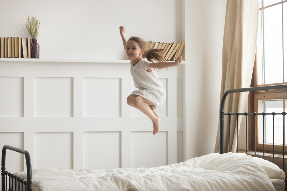 Happy,Preschooler,Girl,Have,Fun,Jumping,High,On,Comfortable,Mattress hyperactivity