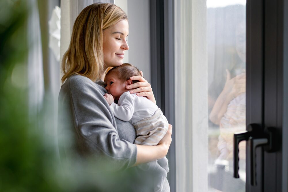 Loving,Mother,Hugs,Her,Little,Baby,At,Home post-delivery