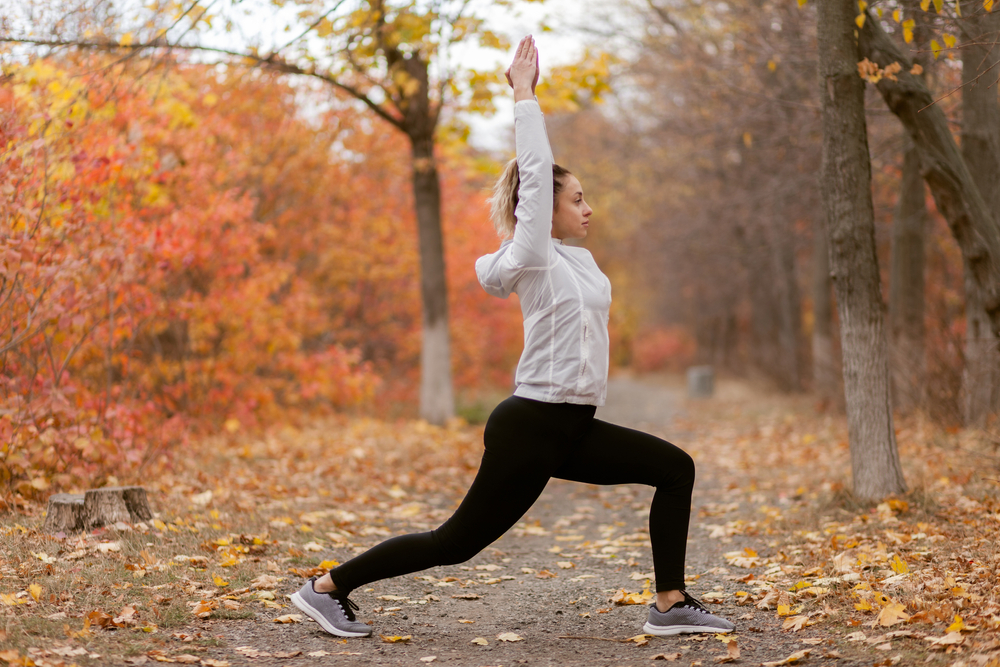 Young,Attractive,Woman,Practicing,Yoga,Asana,Pose,In,Autumn,Forest. Young,Attractive,Woman,Practicing,Yoga,Asana,Pose,In,Autumn,Forest.